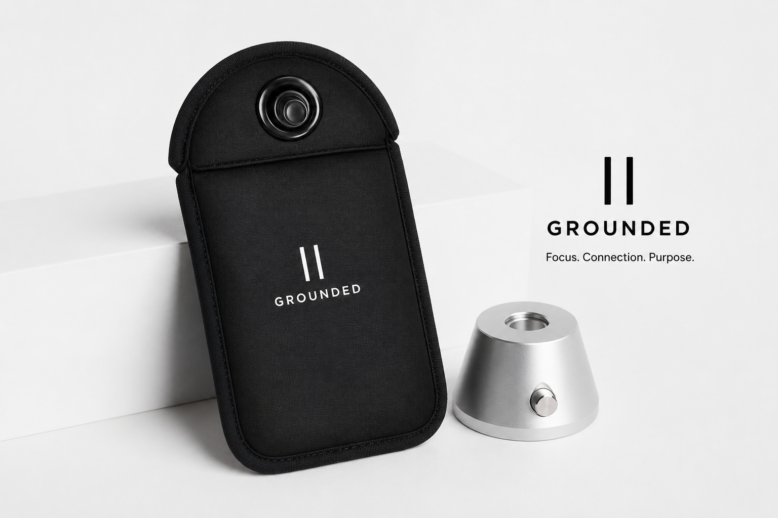 Tall black Grounded phone pouch with flat locking tab and magnetic base unlocker